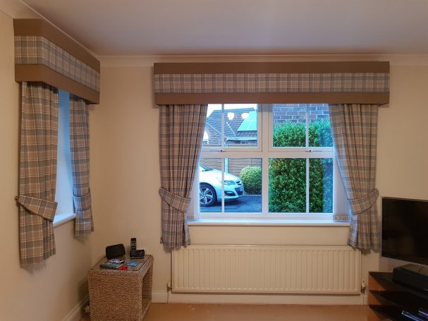 Box pelmet with pencil pleat curtains and tie backs